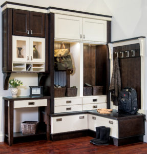 traditional white and dark brown mudroom cabinets