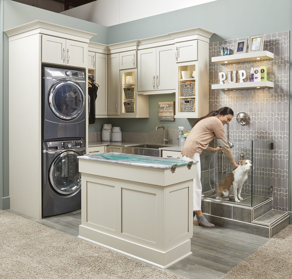 warm beige gray laundry room cabinets 
