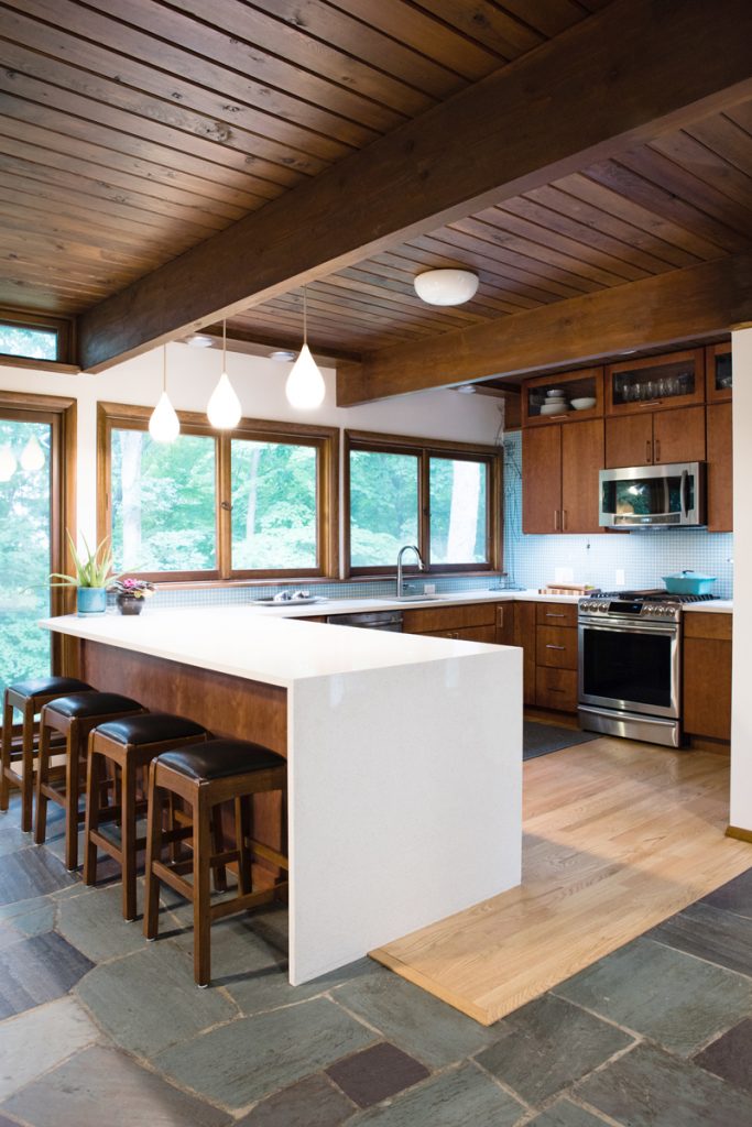 natural kitchen cabinets waterfall countertop natural elements