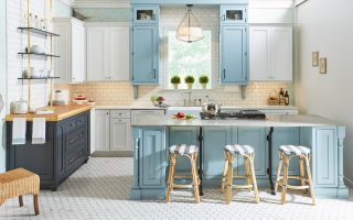 Light blue and white shaker kitchen cabinets and island