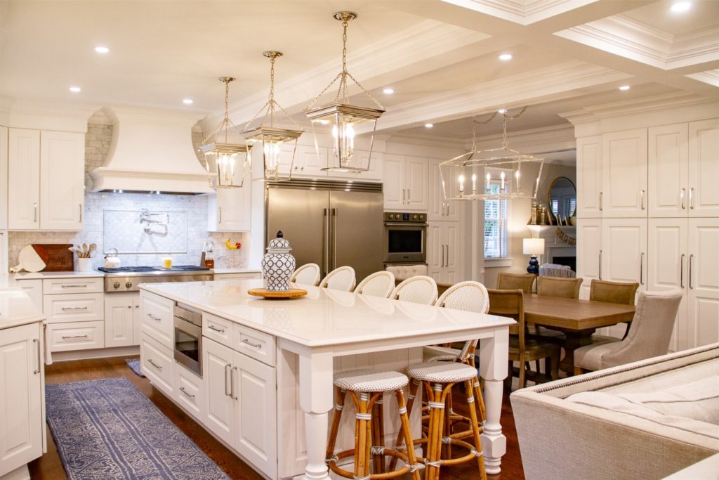 open concept kitchen with white cabinetry