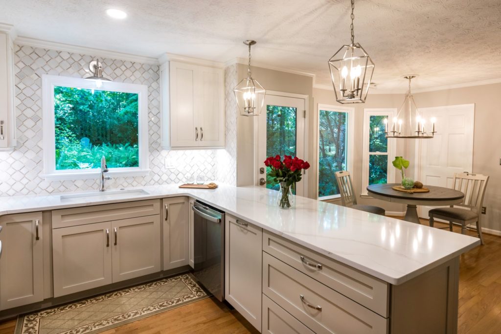 L shaped kitchen with white cabinets