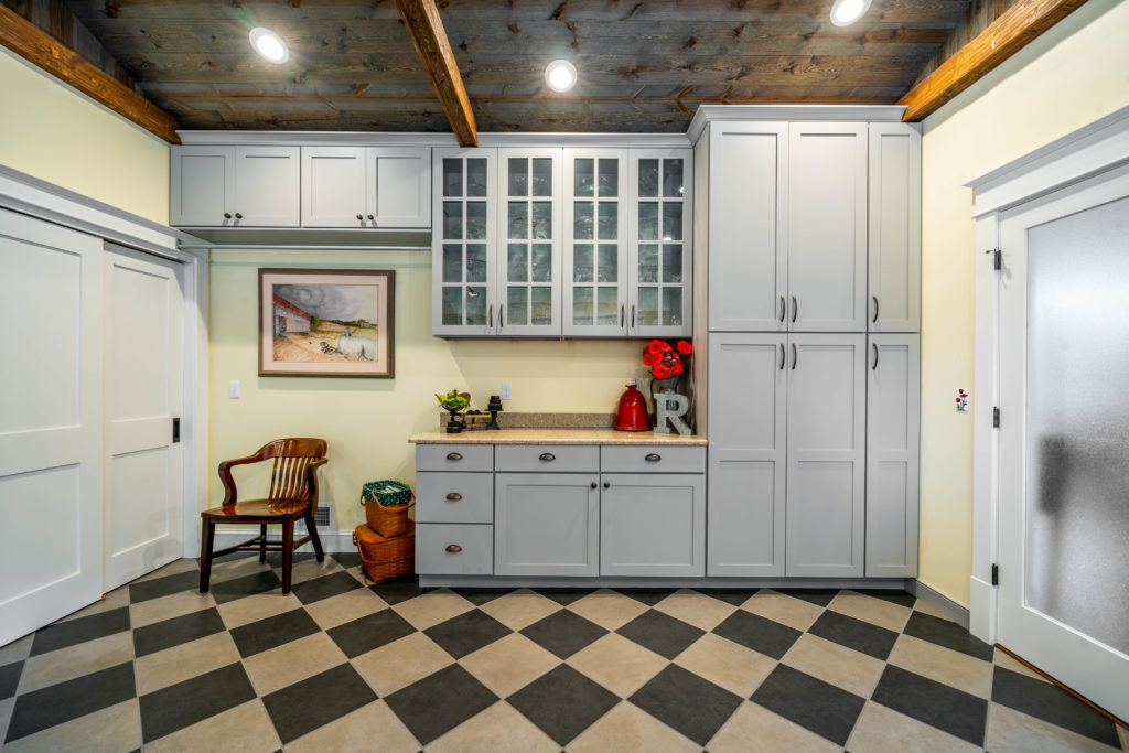 mudroom with gray cabinets
