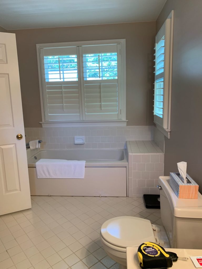 small white bathroom with tub