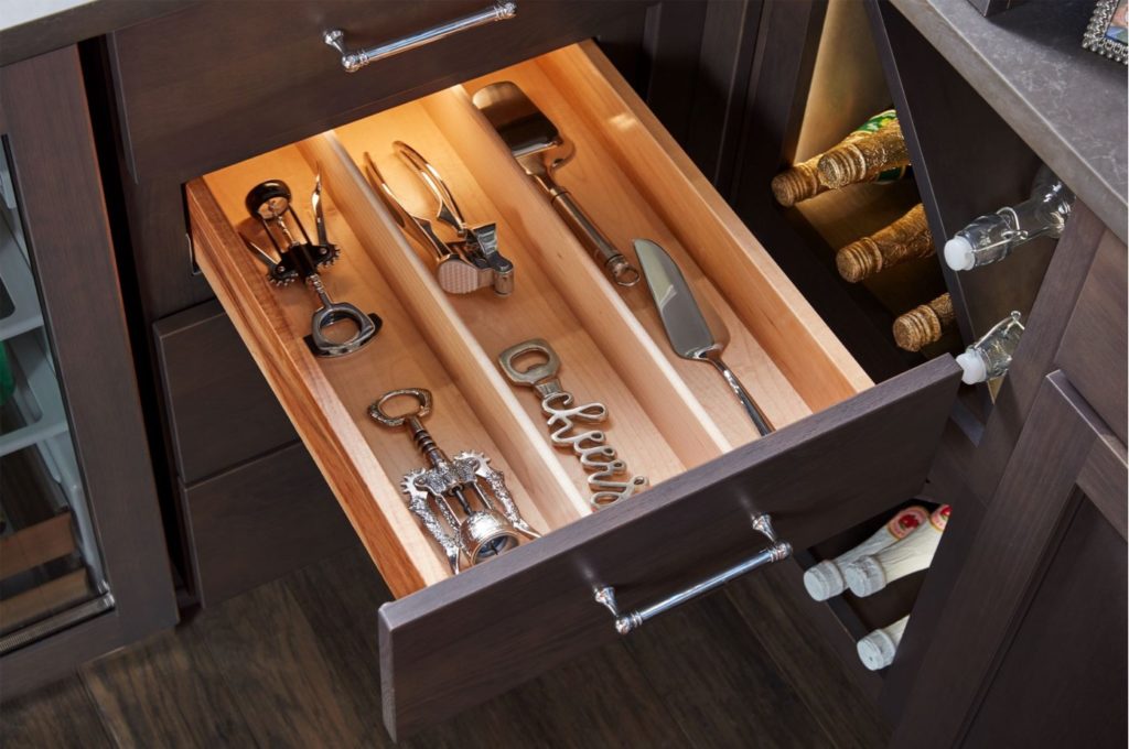 An open kitchen drawer with storage