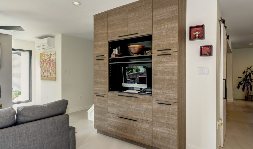 living area with modern entertainment center with a putty oak finish