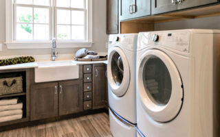 white washer and dryer side by side in laundry room