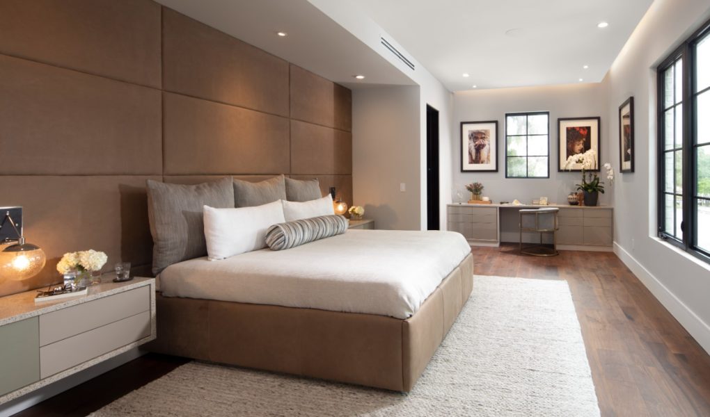 Modern gold accented bedroom with designer laminate cabinetry