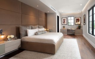 Modern gold accented bedroom with designer laminate cabinetry